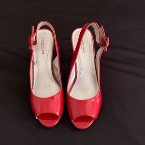 Red patent leather sling peep toe sandle.